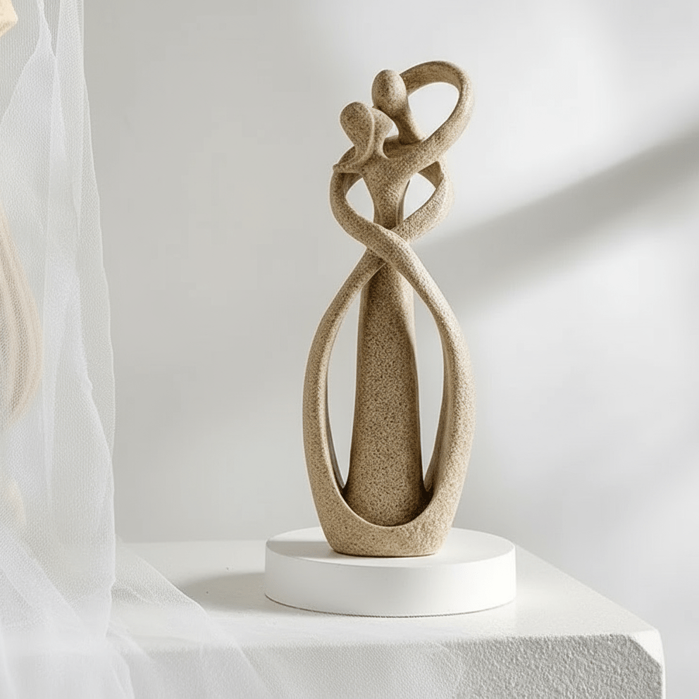 Sand intertwined couple sculpture in soft daylight