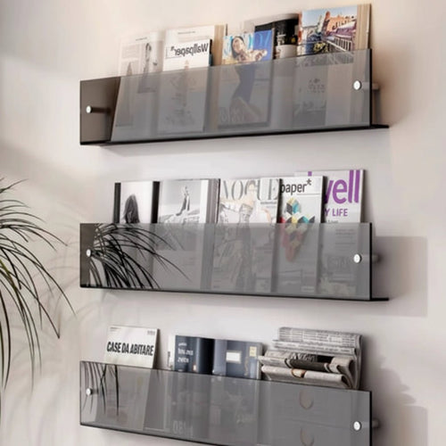 Wall-mounted acrylic magazine rack for organized storage, hero view.