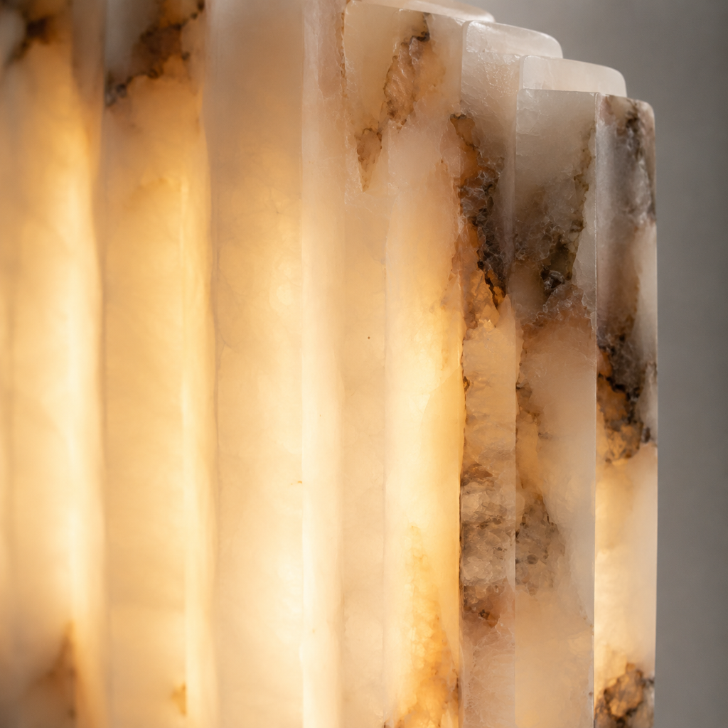 Close-up wall sconce view showing the warm glow and textured translucent shade.