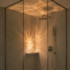 Ambient night light projecting amber patterns inside a tiled walk-in shower