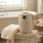 Beige aroma towel warmer bucket on a stool beside a bathtub
