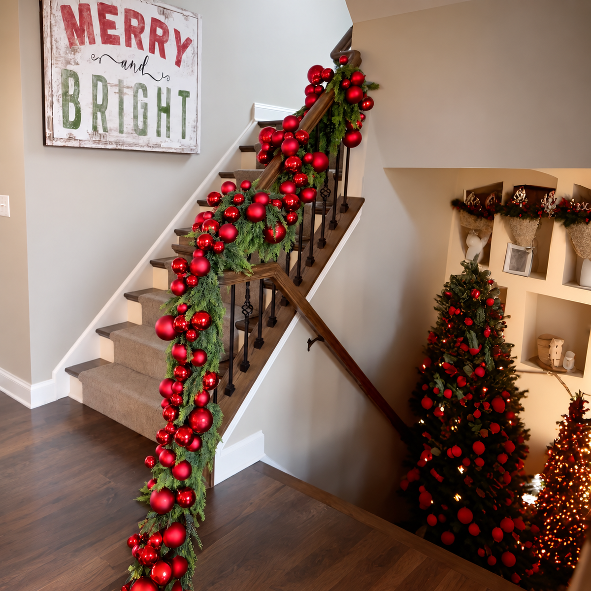 Artificial cedar garland on a stair railing shown with separate red ornament styling
