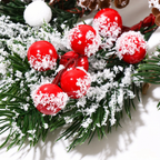 Artificial berries and snowy cedar foliage in a close up detail