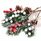 Artificial cedar sprigs close up showing snowy foliage pinecones red and white berries