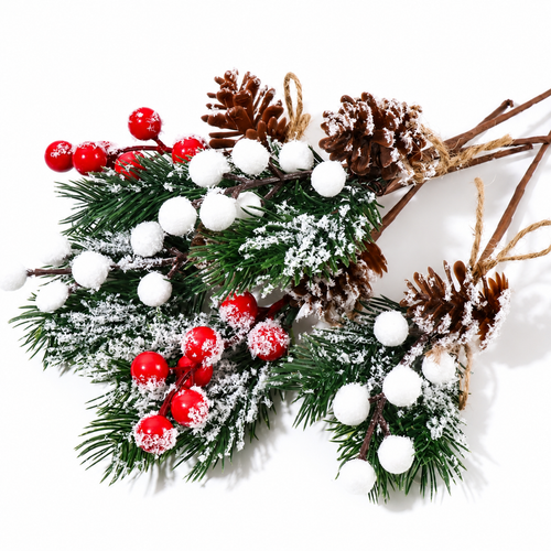 Artificial cedar sprigs close up showing snowy foliage pinecones red and white berries