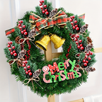 Artificial cedar and red berry sprigs arranged in a decorated Christmas wreath