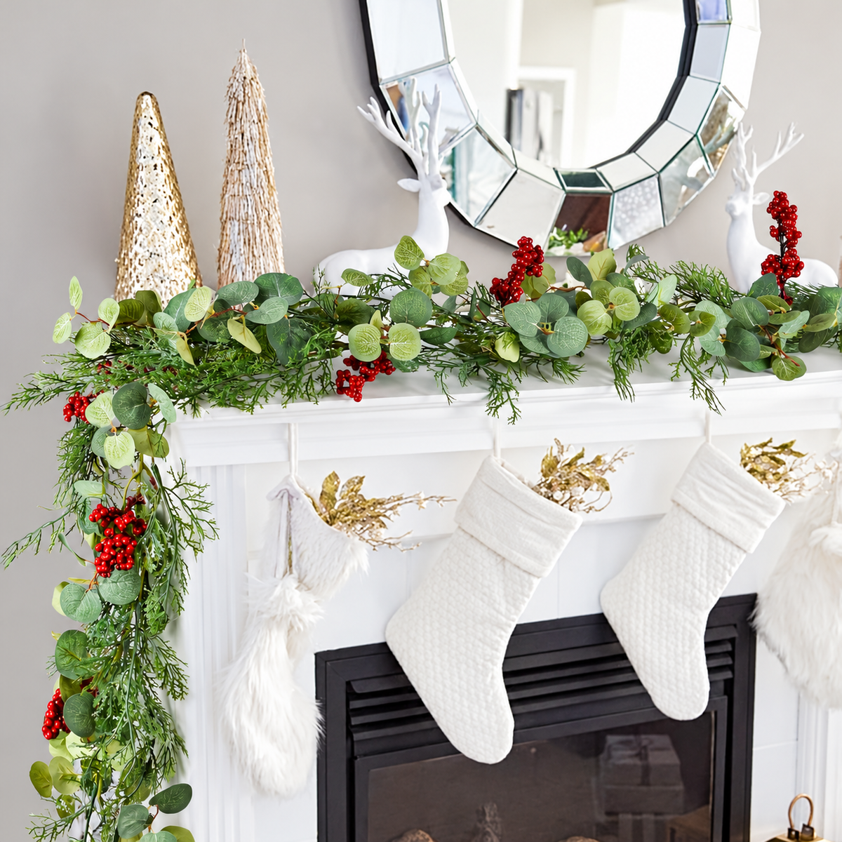 Artificial Christmas garland draped along a white fireplace mantel.