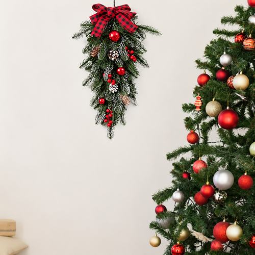 Christmas teardrop swag hanging beside a decorated Christmas tree