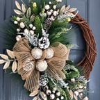 Close up of cream and gold wreath foliage ribbon bow and white berries