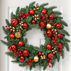 Artificial Christmas wreath with red and gold baubles berries and pine style foliage on a white door