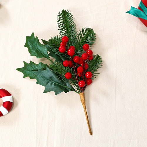 Artificial holly and pine Christmas pick with green leaves red berry details and brown stem