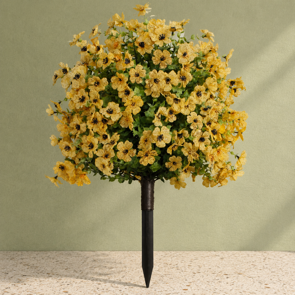 Yellow artificial outdoor flowers against sage canvas and cream terrazzo