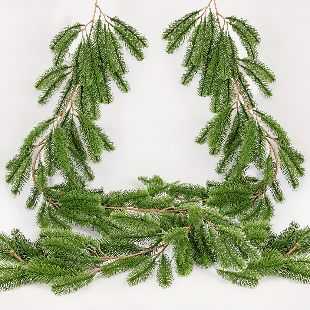 Artificial pine garland draped loosely showing branches and central stems