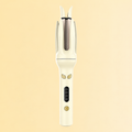Cream yellow automatic curler on its original warm backdrop