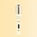 Cream yellow automatic curler on its original warm backdrop
