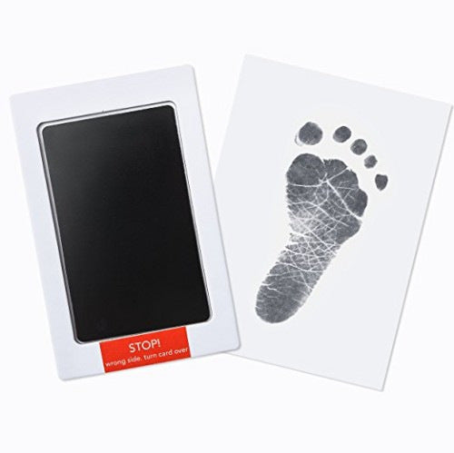 Baby handprint kit with a black transfer pad and footprint card