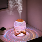 Purple lit ball humidifier in its original tabletop setting