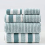 Bath towel set in green and white stripes stacked in eight pieces.