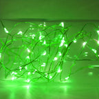 Green fairy string lights illuminated in a decorative strand