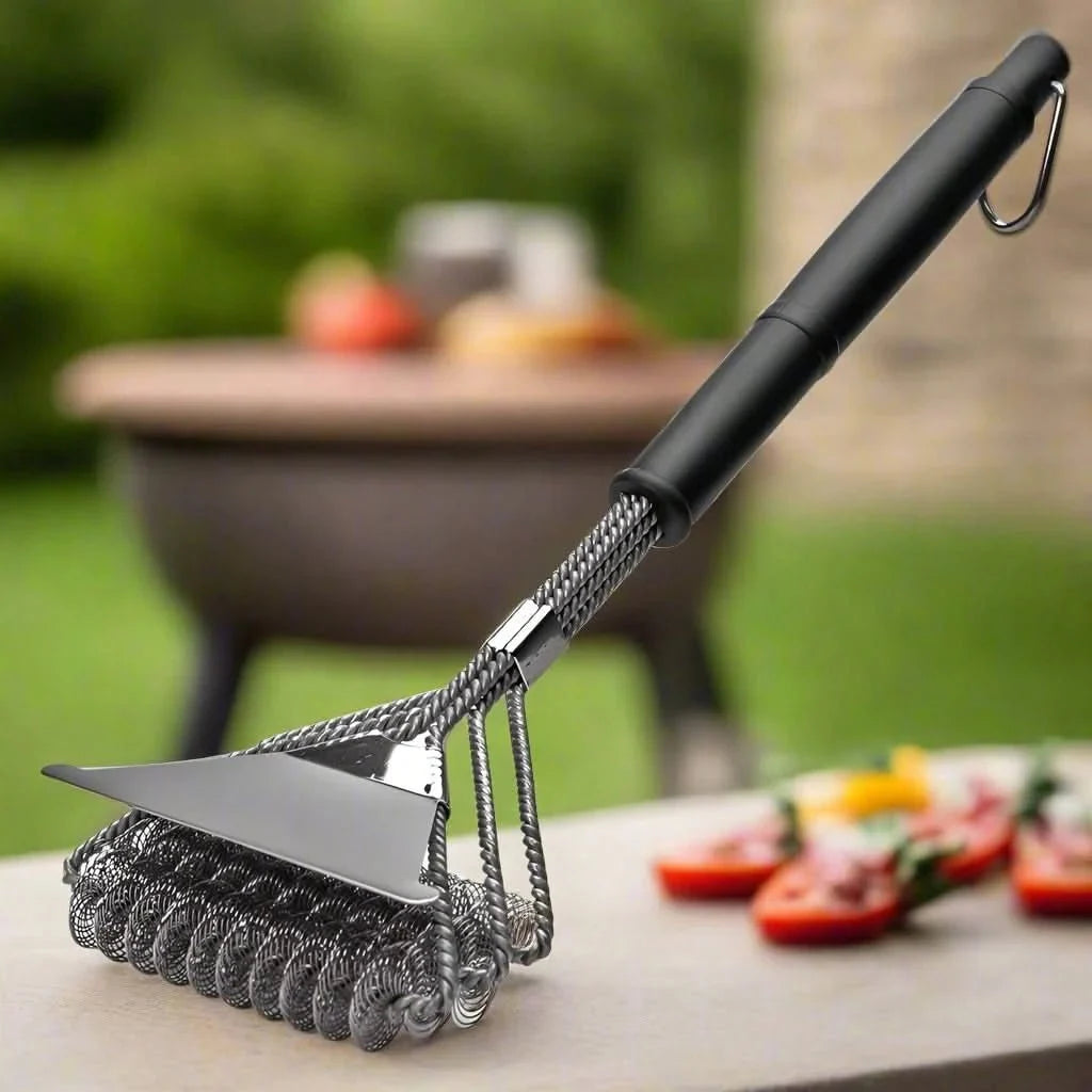 Person cleaning a round grill grate with a long-handled stainless steel brush.