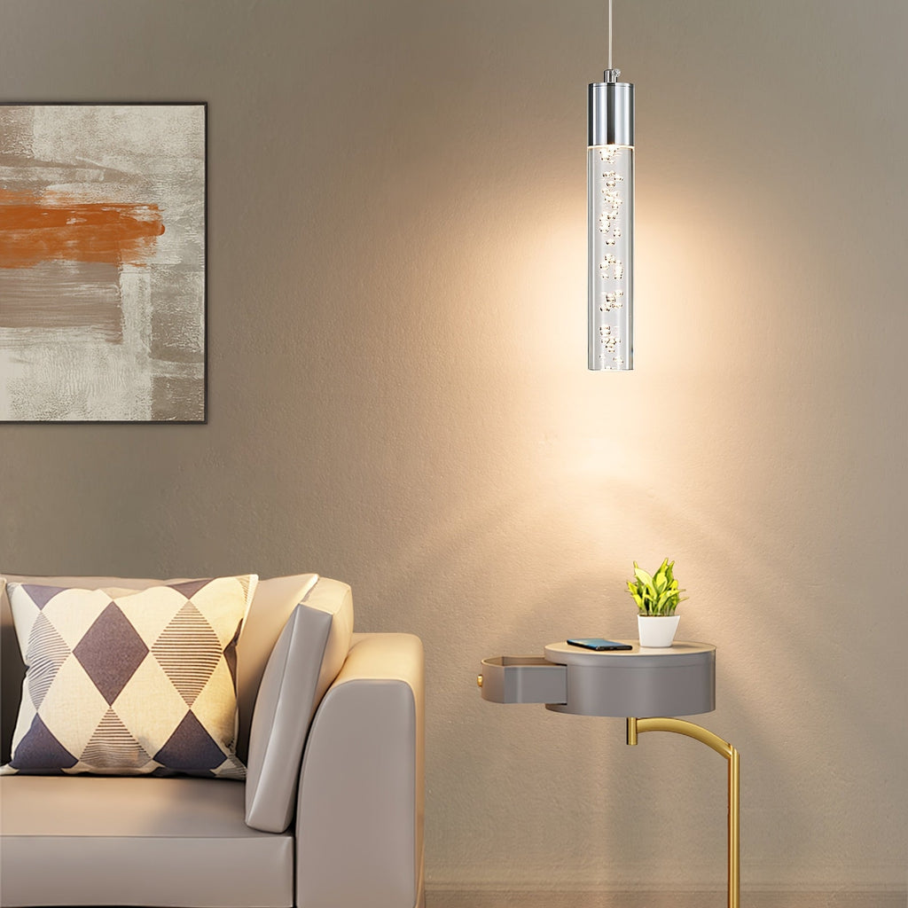 Single silver bubble acrylic pendant above a living room side table