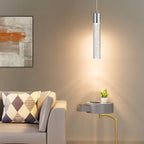 Single silver bubble acrylic pendant above a living room side table