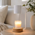 White candle warmer lamp isolated with round wood base.