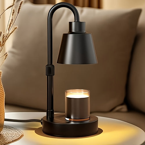 Black candle warmer lamp illuminating a jar candle on a table beside a sofa.