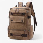 Khaki canvas backpack worn from the back