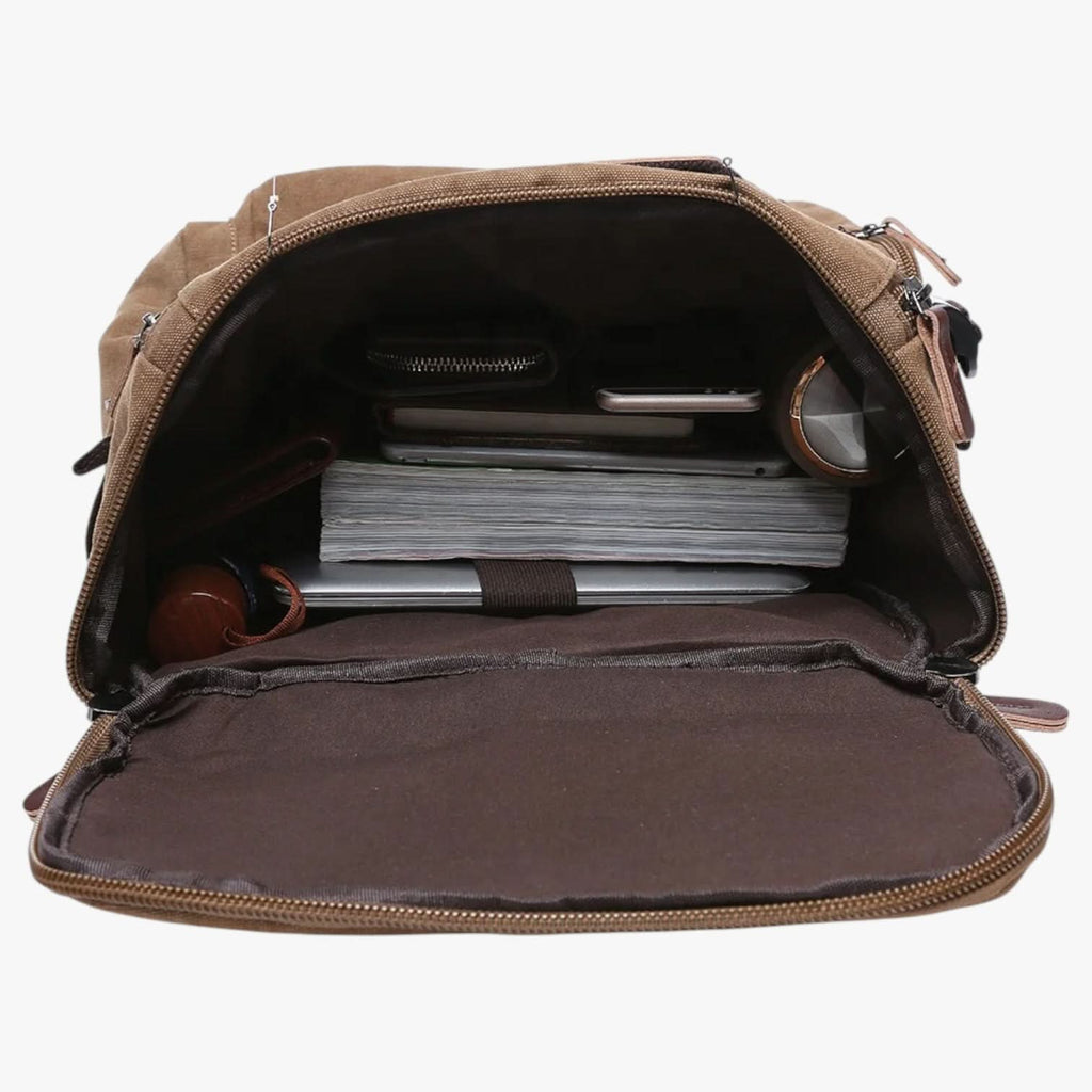 Coffee brown canvas laptop backpack on a white background
