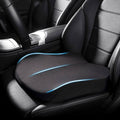 Black tapered memory foam car seat booster cushion installed on a car seat