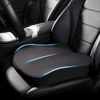 Black tapered memory foam car seat booster cushion installed on a car seat