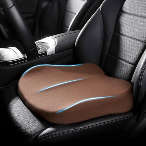 Brown tapered memory foam car seat booster cushion installed on a car seat