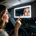 Black LED car visor makeup mirror in a vehicle