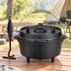 Black camping Dutch oven and lid lifter on an outdoor table