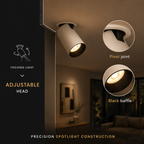 A modern adjustable ceiling spotlight shown in a warm-toned interior setting, with callout circles highlighting a pivot joint and black baffle detail. Text on the left reads 'Focused Light', 'Adjustable Head', and 'Precision Spotlight Construction'.
