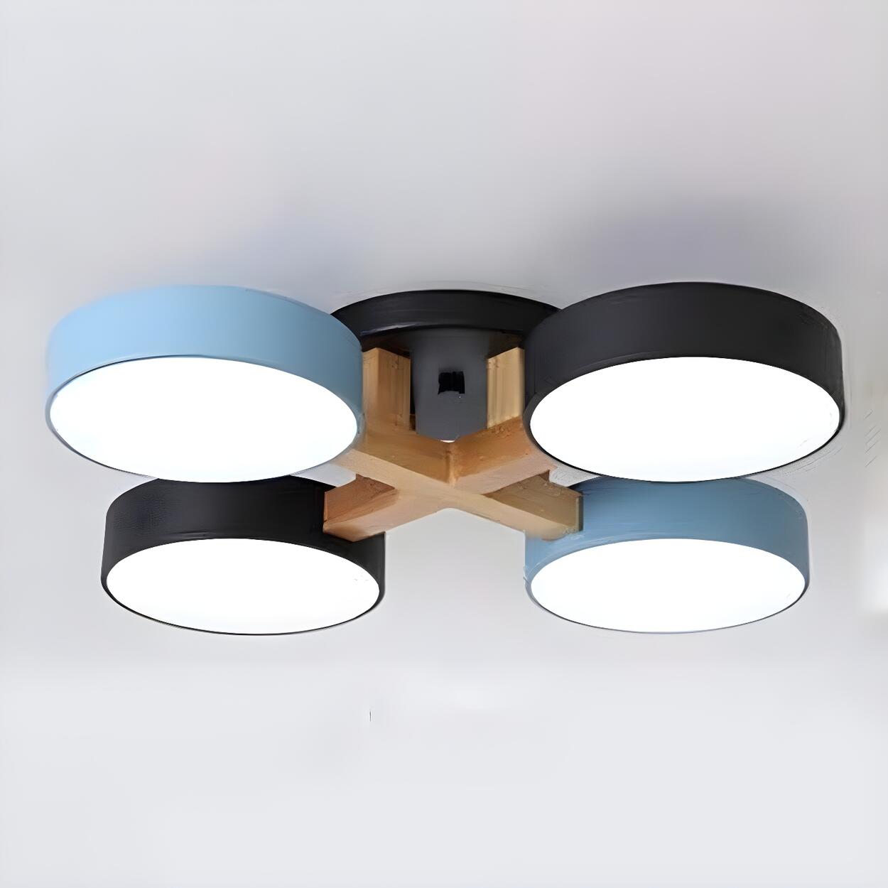 Blue and black ceiling light with four round shades and wood details.