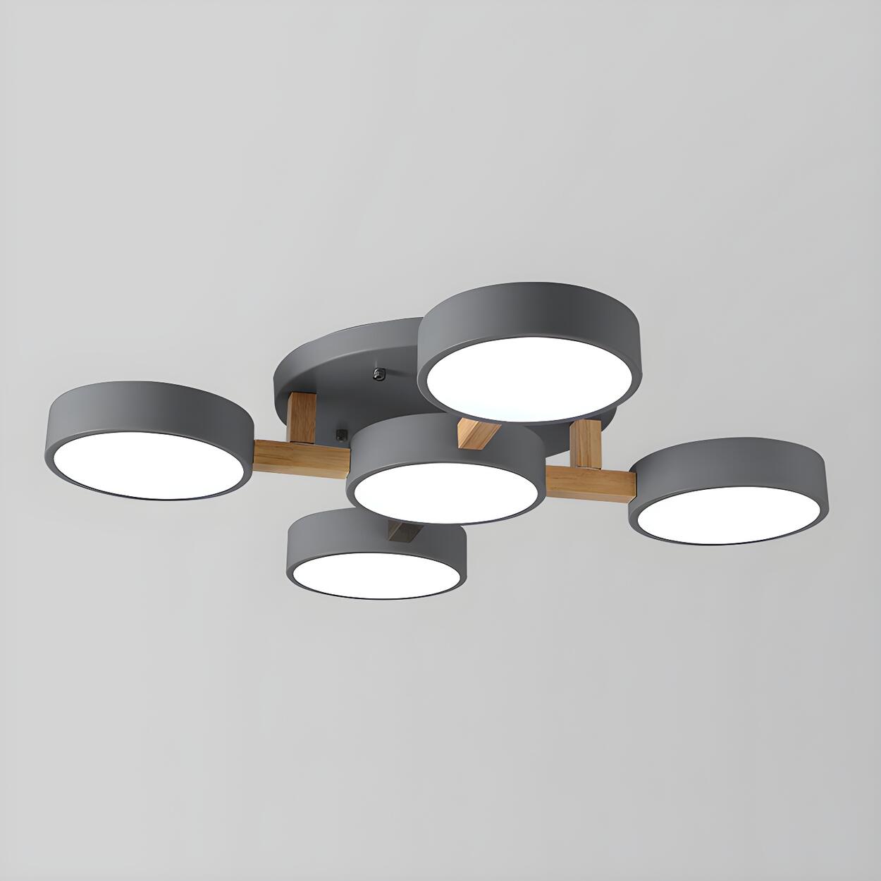 Gray ceiling light with five round shades and wood details.