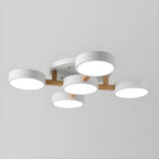 White ceiling light with five round shades and wood details.