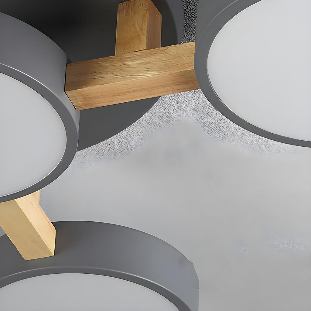Close detail of the wood supports and gray shades on the ceiling light.