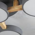 Close detail of the wood supports and gray shades on the ceiling light.