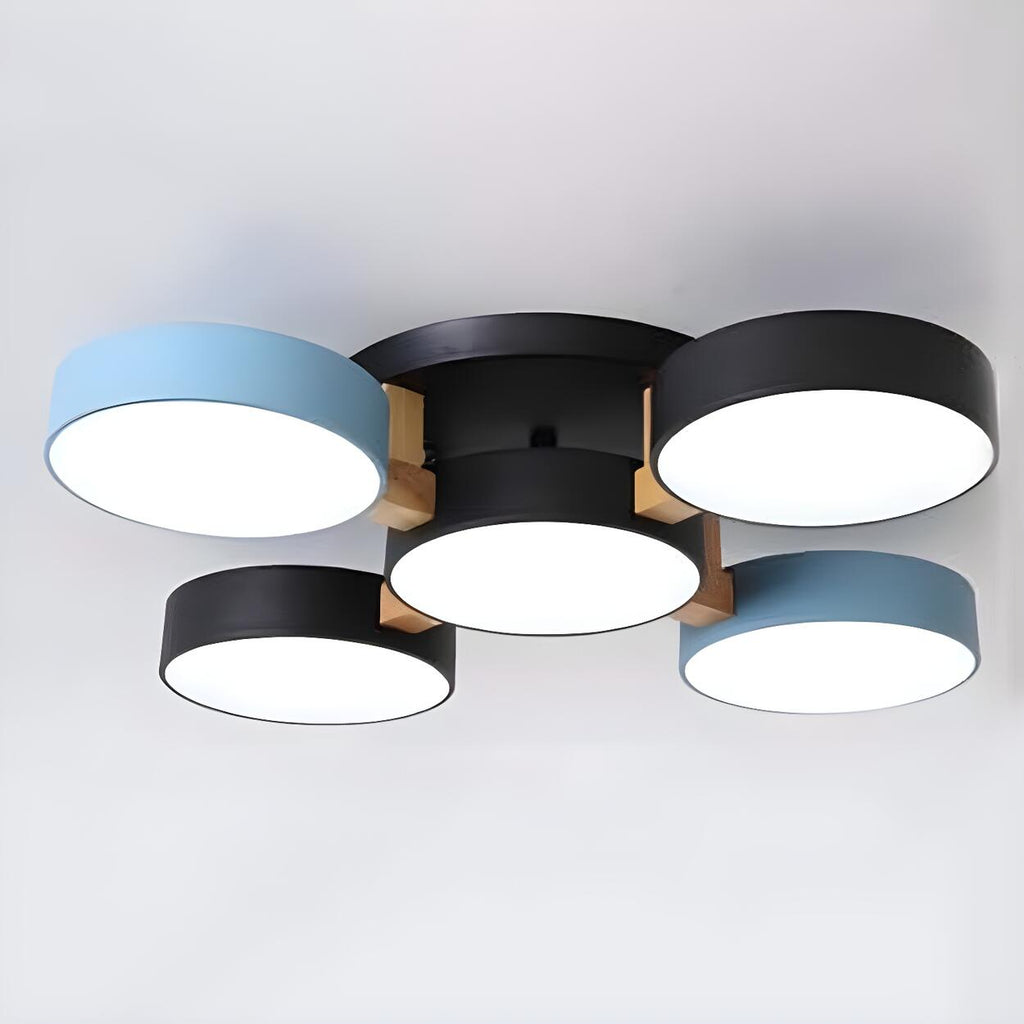 Blue and black ceiling light with five round shades and wood details.