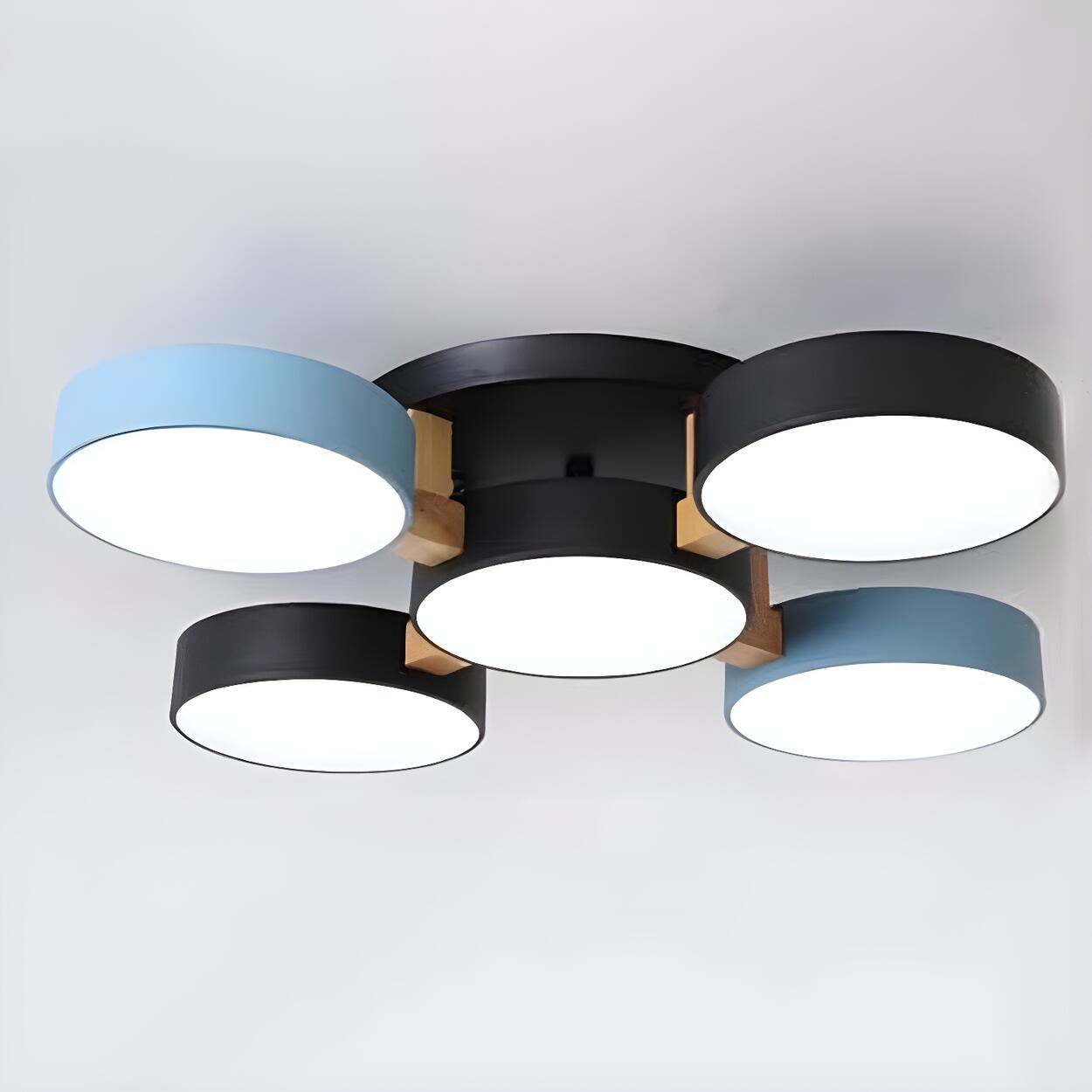 Blue and black ceiling light with five round shades and wood details.