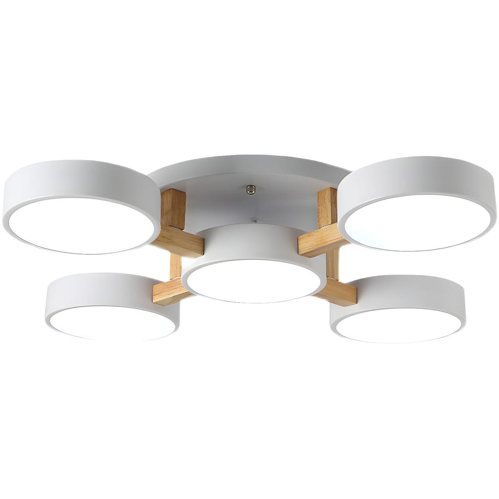 White ceiling light with five round shades viewed from below.