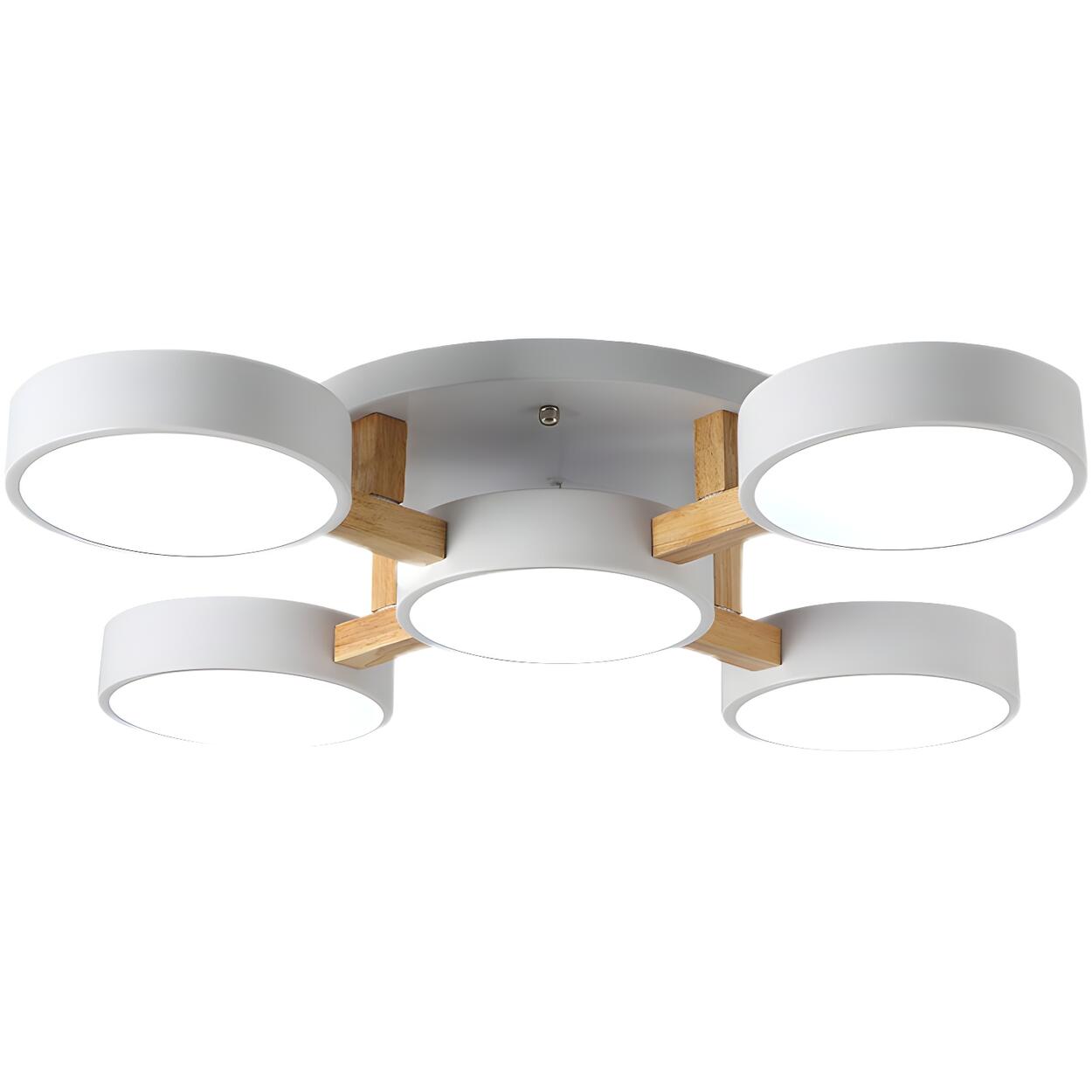 White ceiling light with five round shades viewed from below.