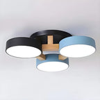 Blue and black ceiling light with three round shades and wood details.