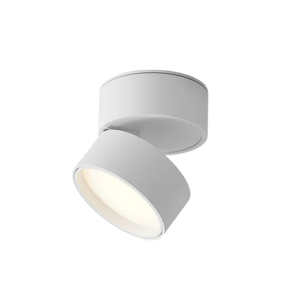 White ceiling spotlight with a tilted round LED head on a white background.