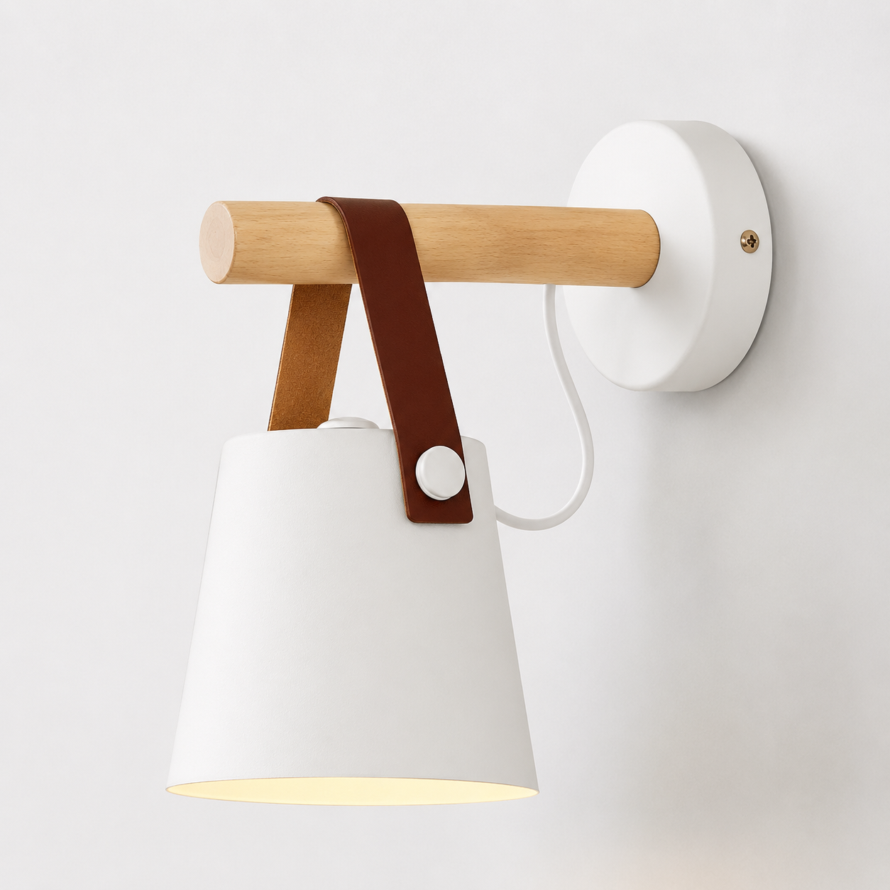 White wall sconce with a hanging iron shade, wood support, brown strap, and matching round wall plate.