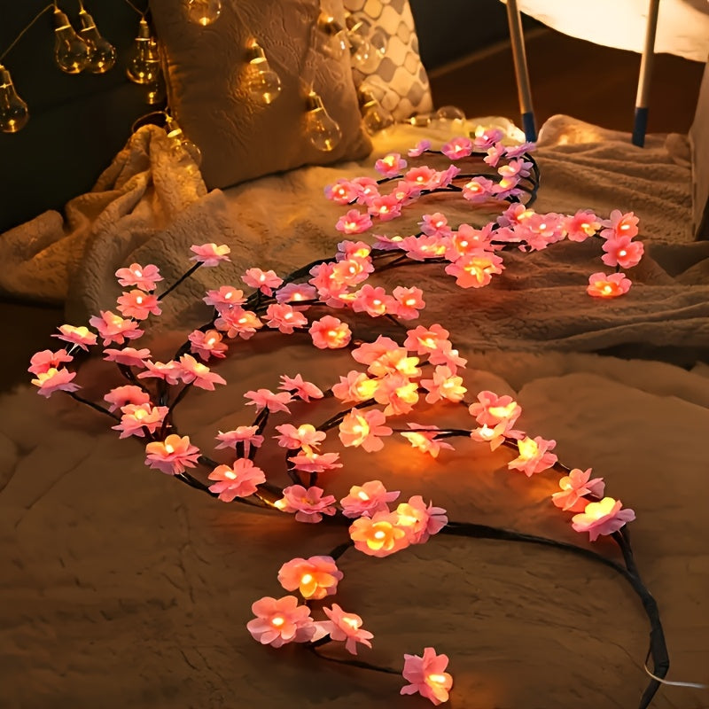 Pink blossom lights arranged over a bed