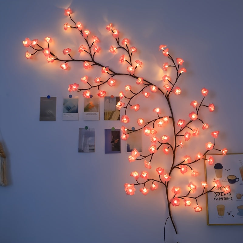 Cherry blossom branch lighting along a bedroom wall